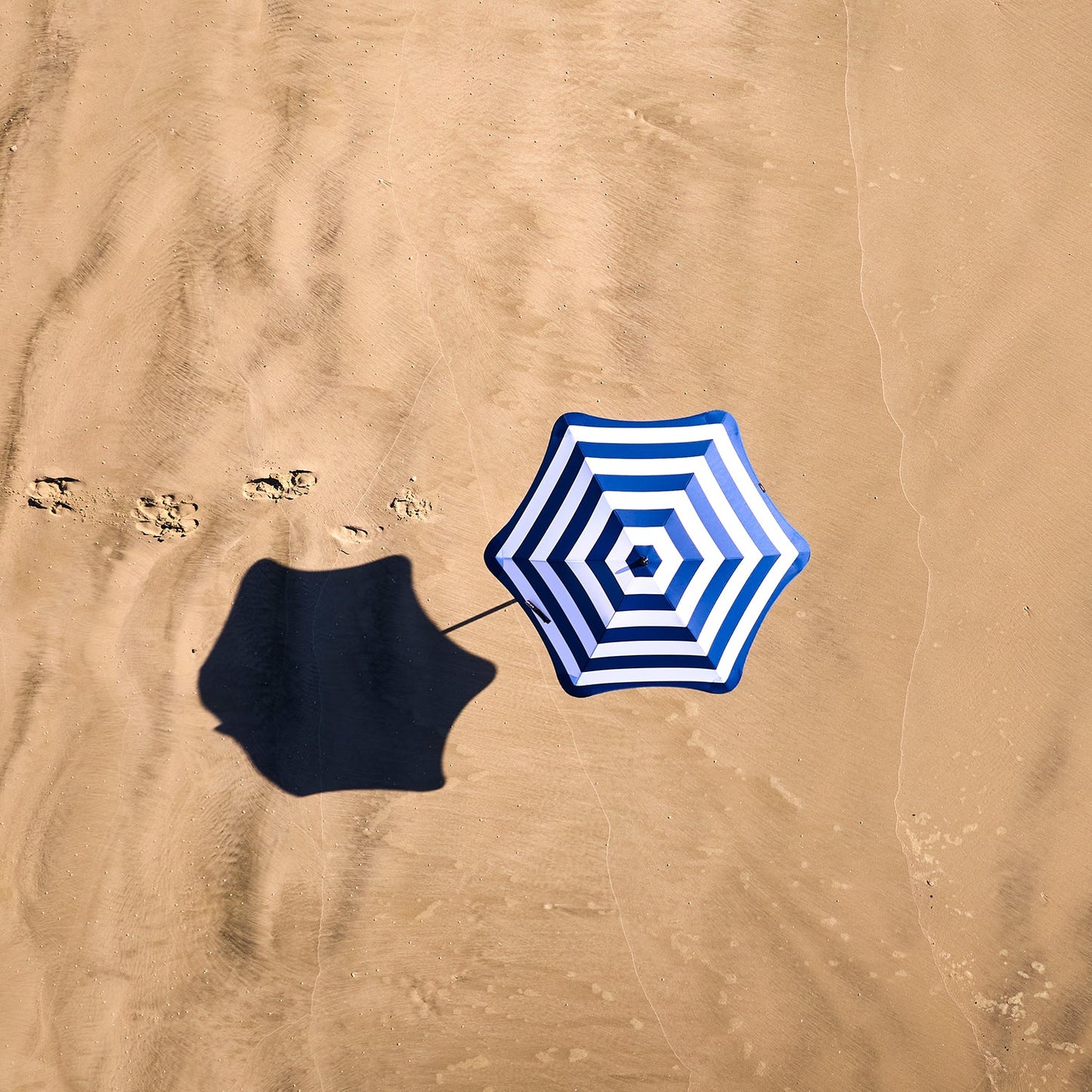 blunt | beach umbrella | sea